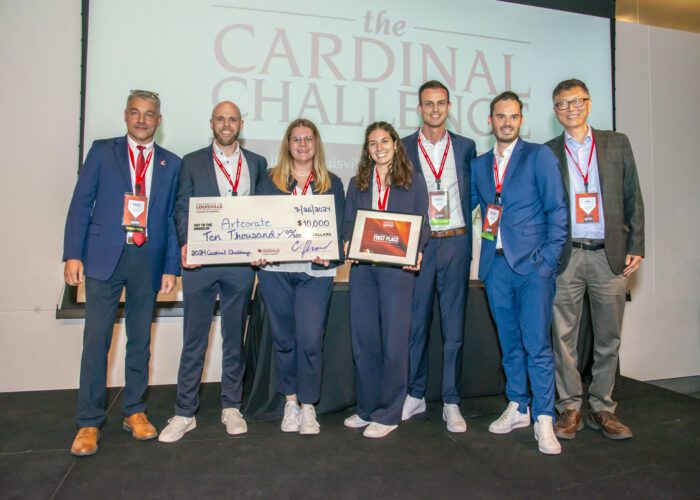 Sergey Anokhin, PhD, and Jeff Guan, PhD., stand with the winning team members of the 2024 Cardinal Challenge event