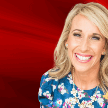 Aly Van Iten in front of a red flame background