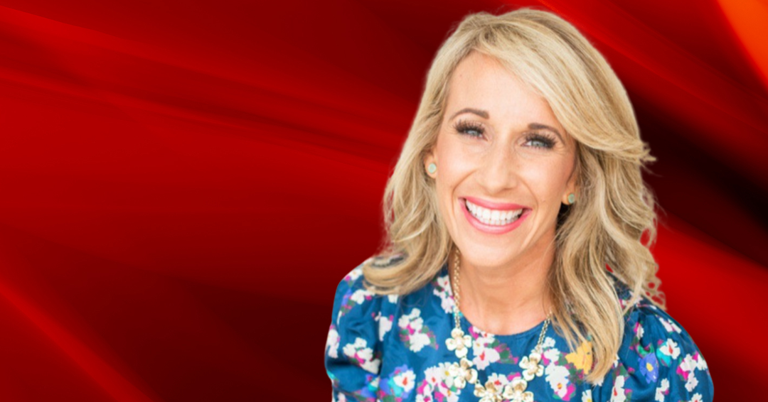 Aly Van Iten in front of a red flame background