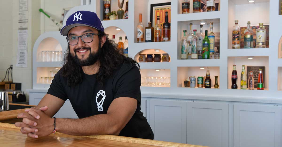 Joshua Gonzalez stands behind his bar at FOKO restaurant