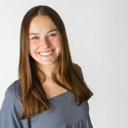 Kelsey Bruggeman poses for a photo with a white background