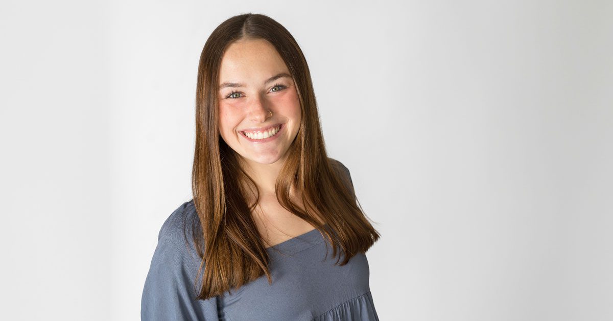 Kelsey Bruggeman poses for a photo with a white background