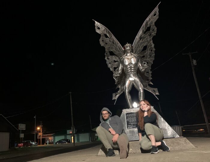 Katie Jo Glesing poses in front of the Mothman statue in Point Pleasant, West Virginia