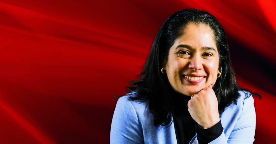 Isabel Botero, Ph.D. in front of a red flame background