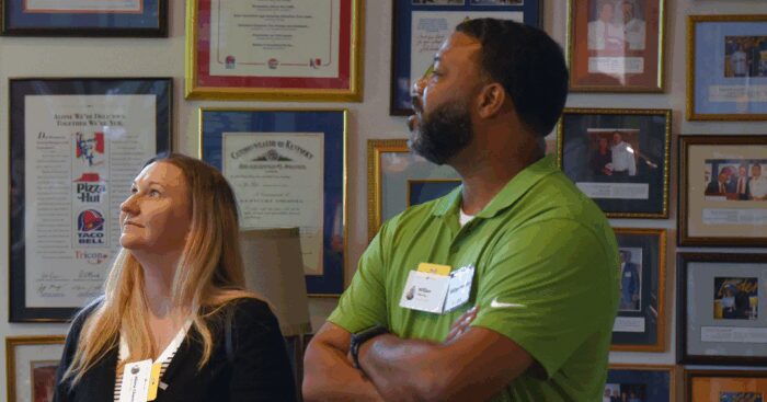 Two Accelerating Enterprise Growth program participants visit the Yum! Brands headquarters