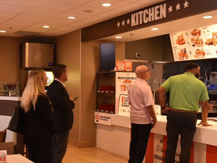 Accelerating Enterprise Growth attendees visit Yum! Brands headquarters, where they visit a fully-functioning Kentucky Fried Chicken leadership training restaurant