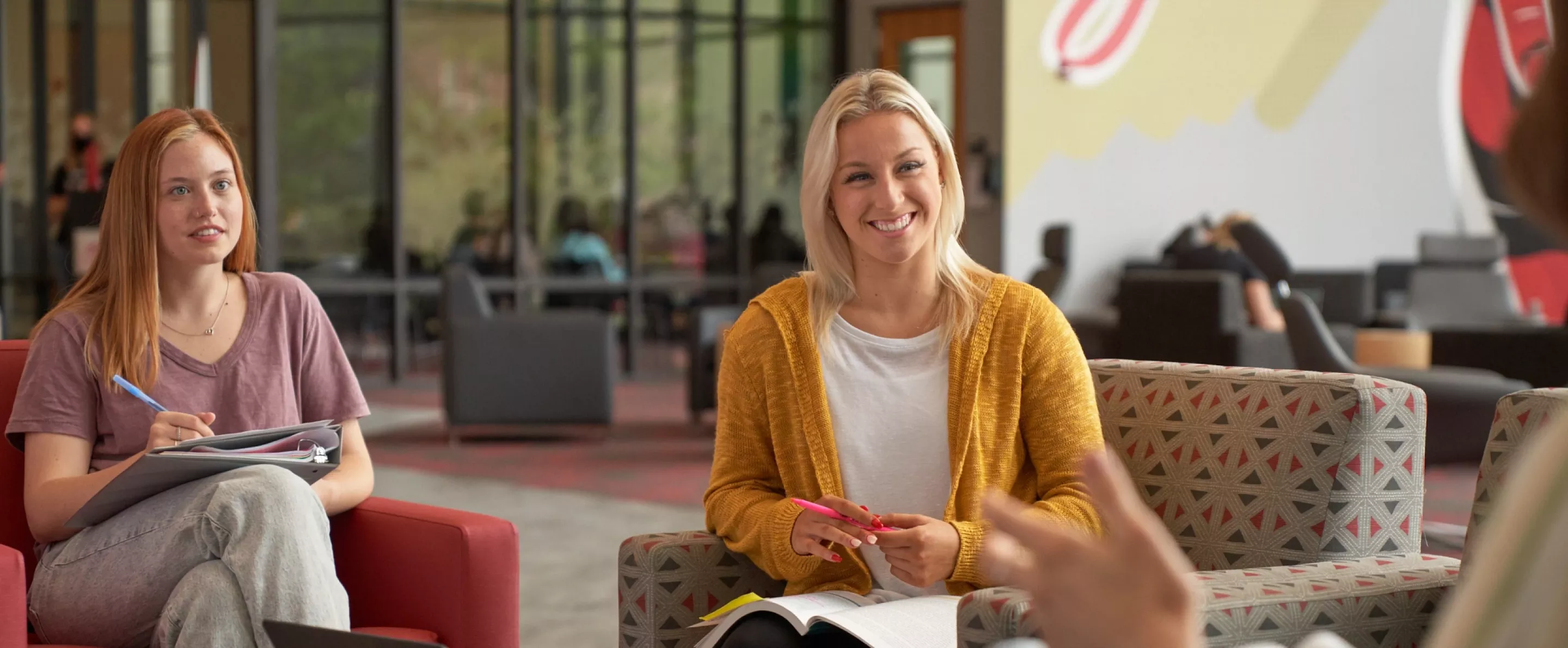Students sitting around and talking in the SAC.