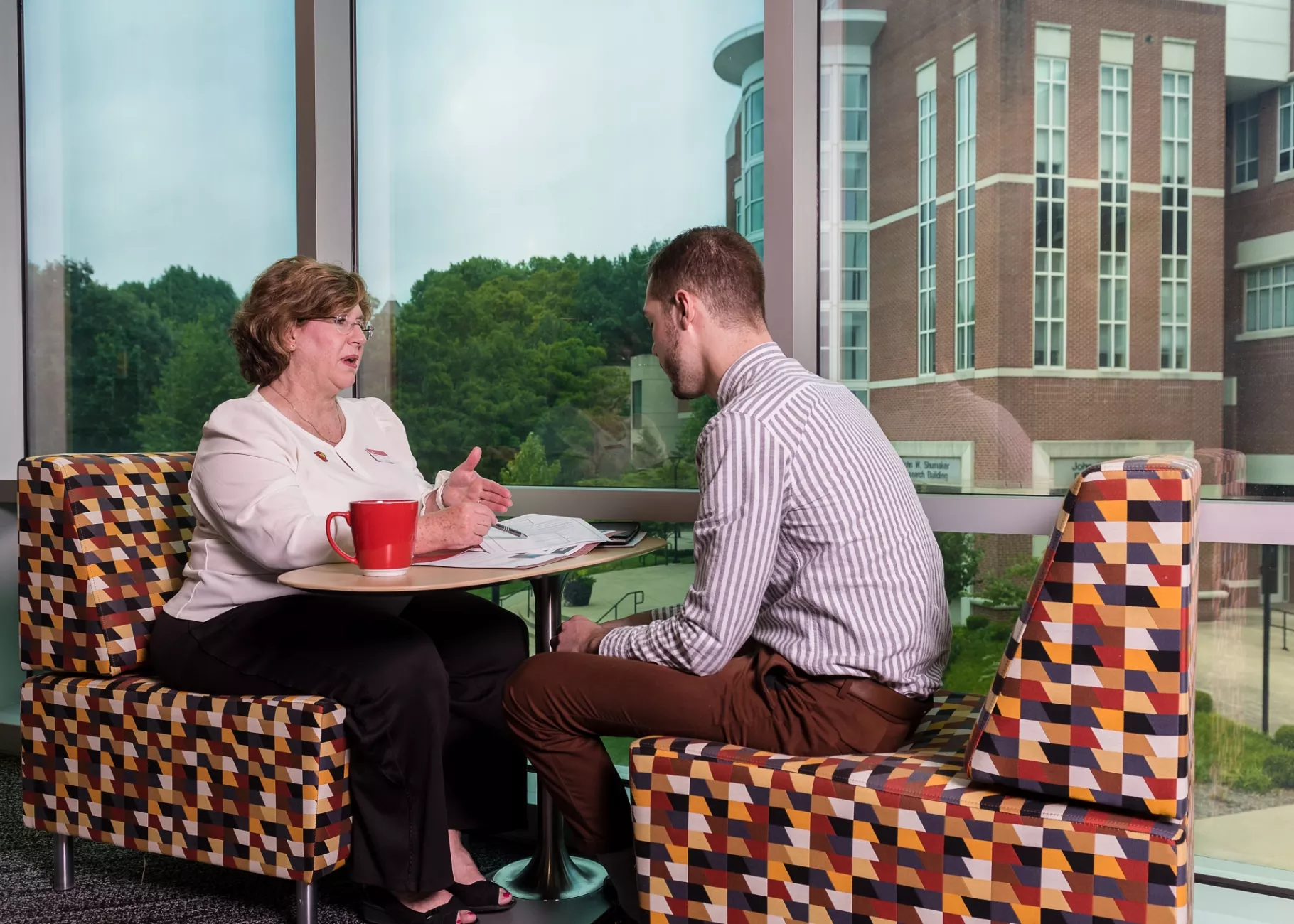 Female supervisor having a meeting with male employee