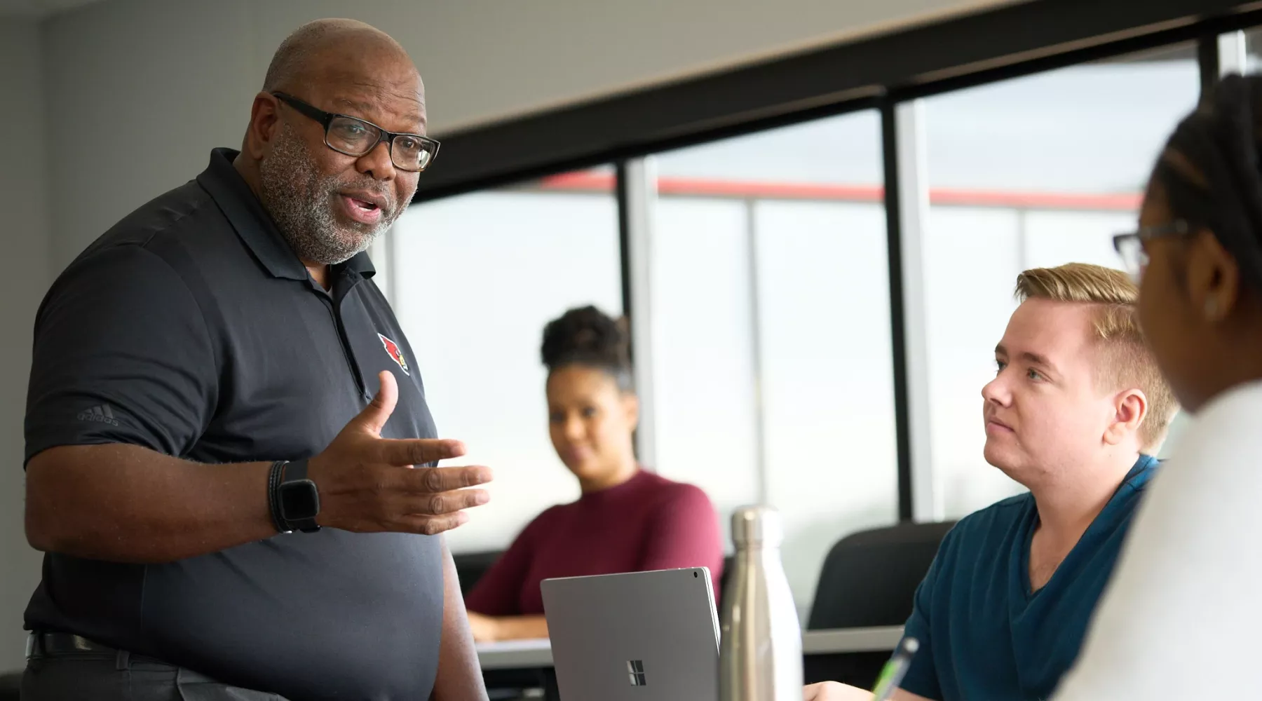 Professor Michael Wade teaching students in the College of Business.