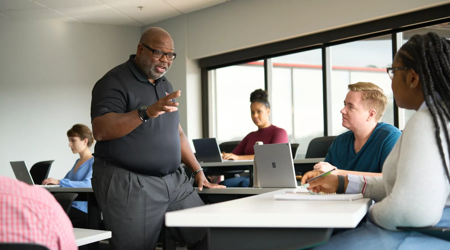 Professor Michael Wade teaching students in the College of Business.
