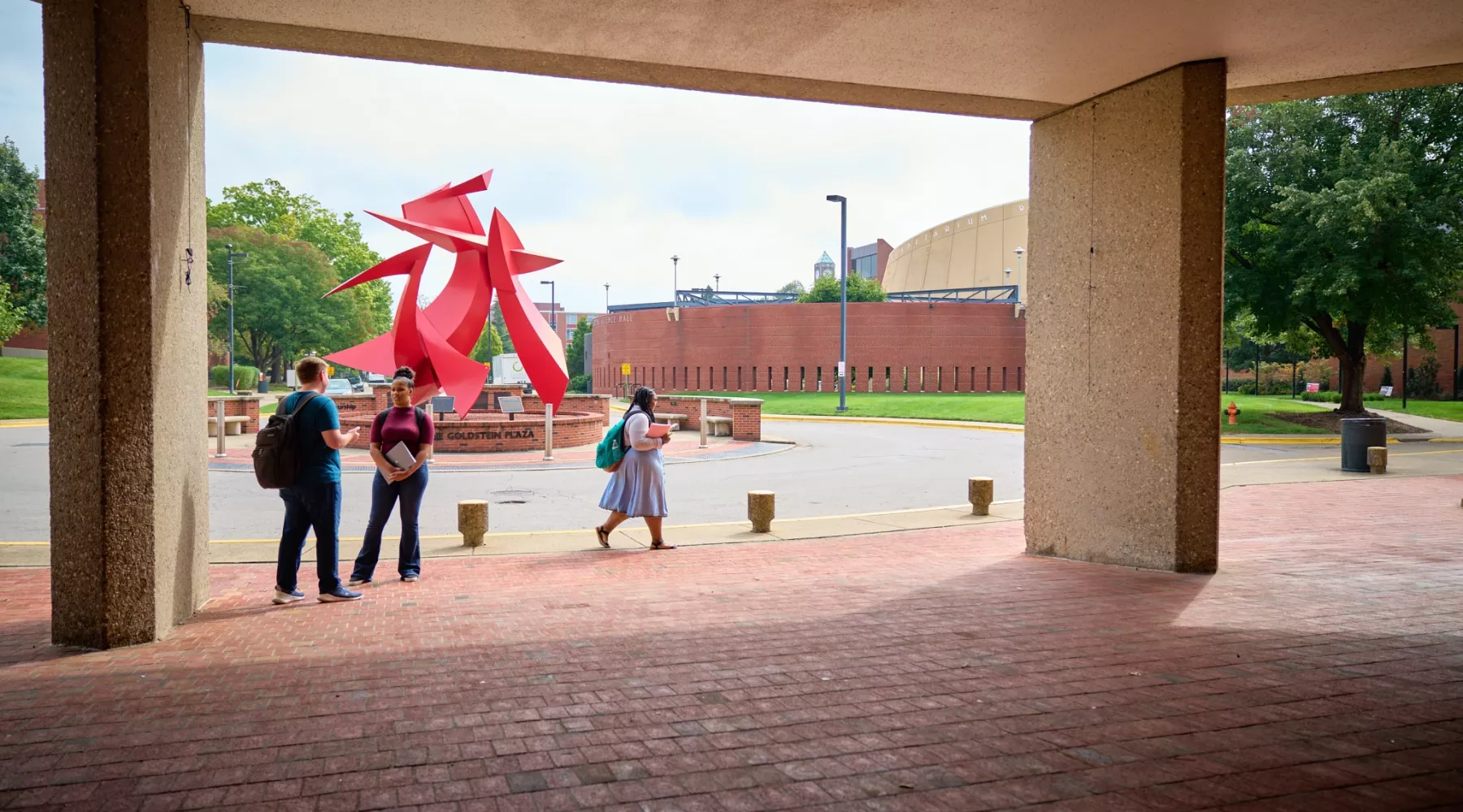 Students in front of the college of business.