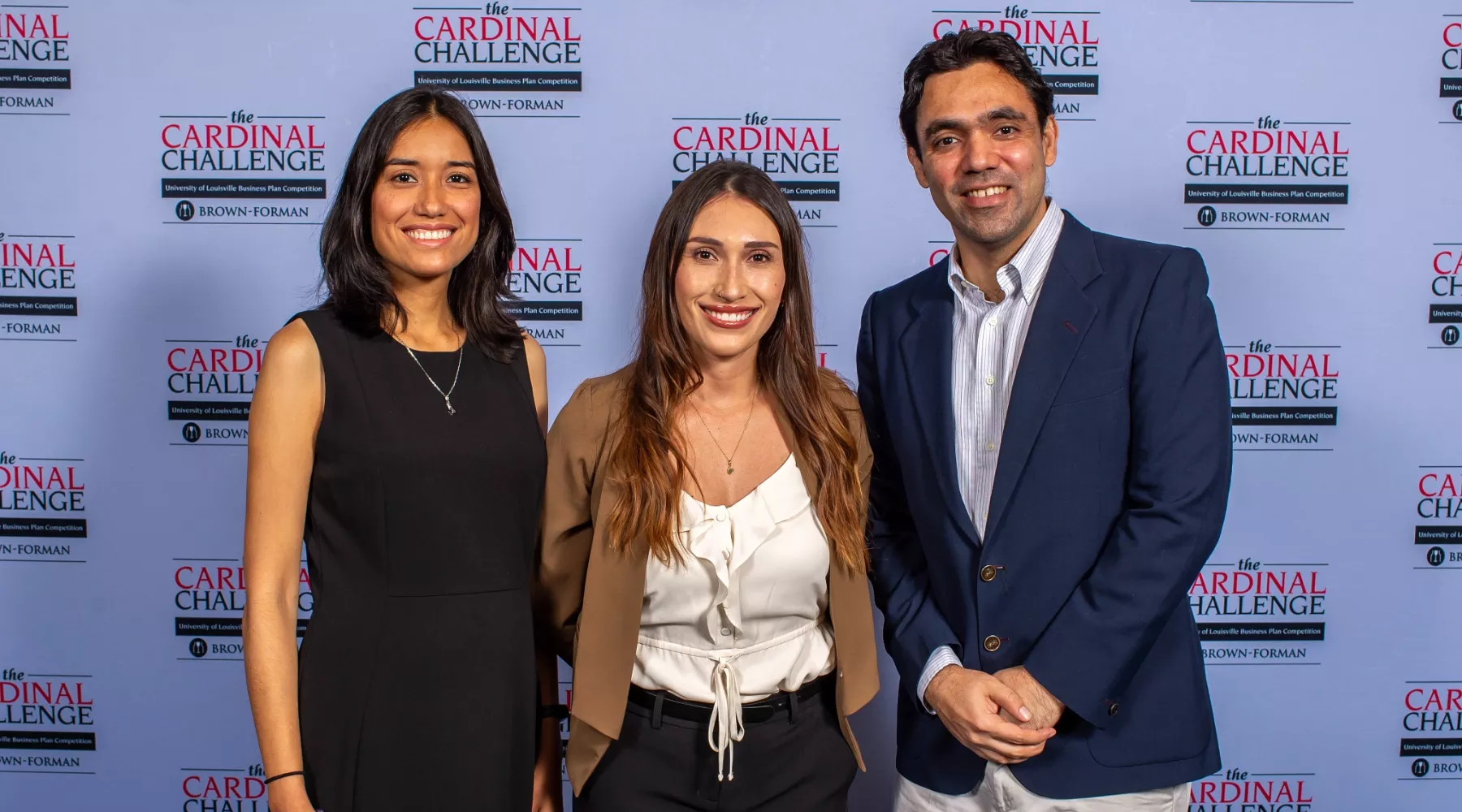 Team of entrepreneurs posing for a photo at the Cardinal Challenge hosted by the Forcht Center for Entrepreneurship at the University of Louisville College of Business