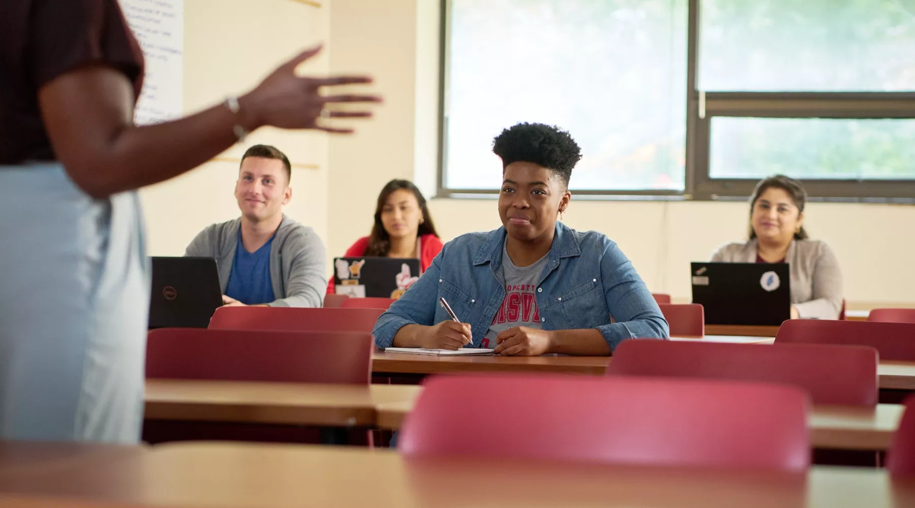 Female professor teaches her class.