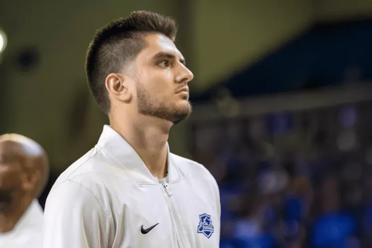 Ethan Coury on basketball court, focused