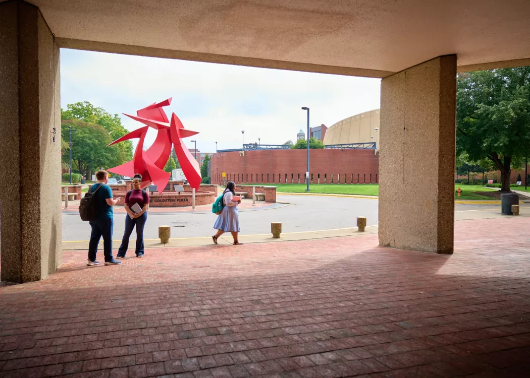Students in front of the college of business.