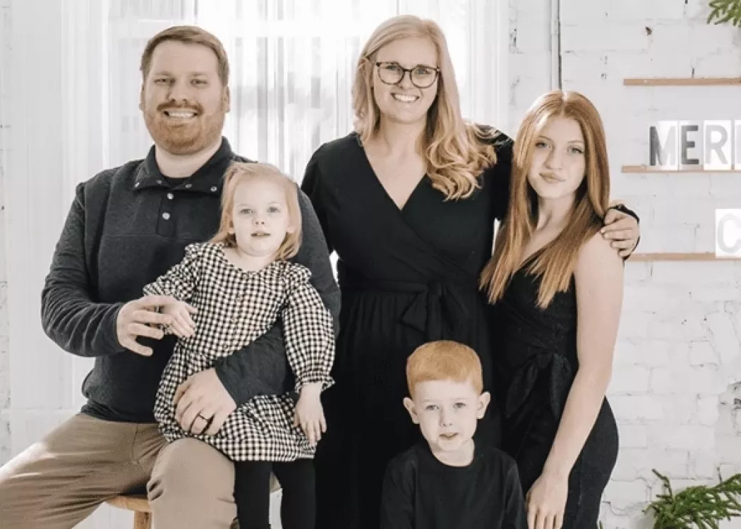 A teacher looking over a group of students in class.