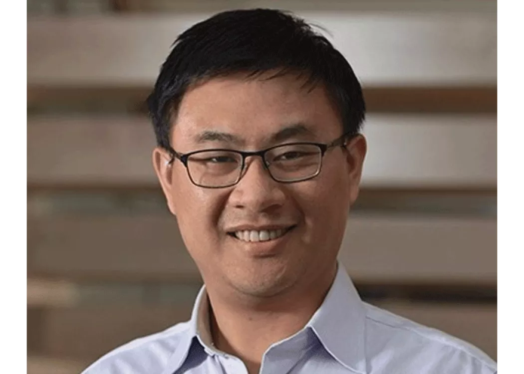 Headshot of a man in glasses.