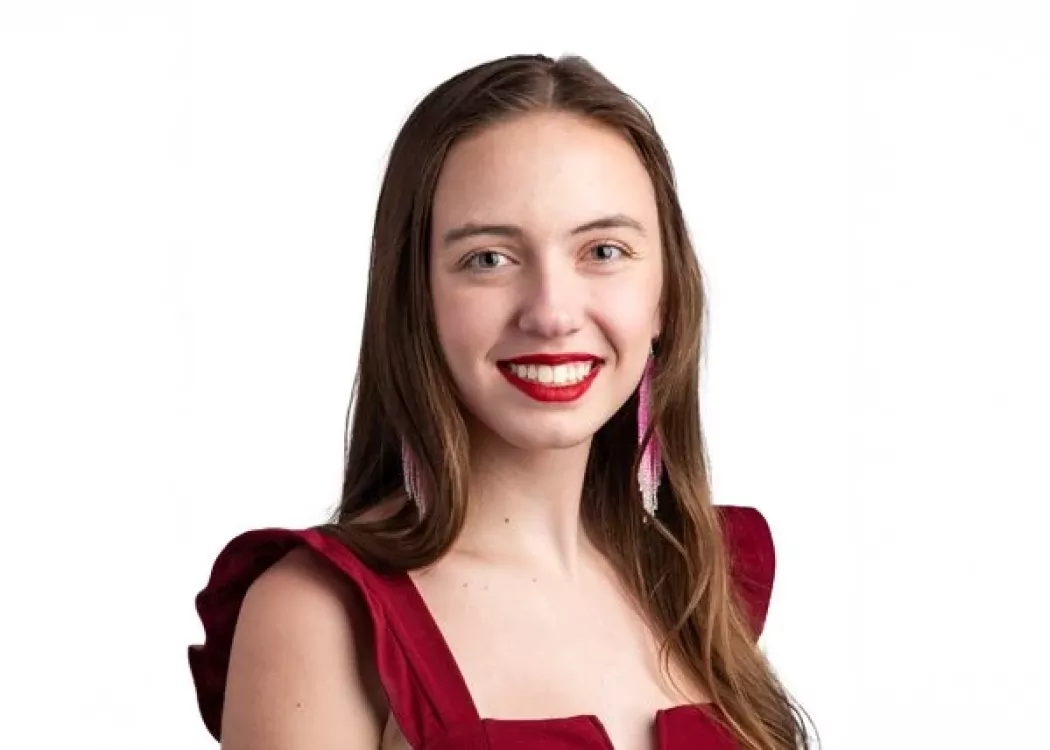 Headshot of a woman smiling.