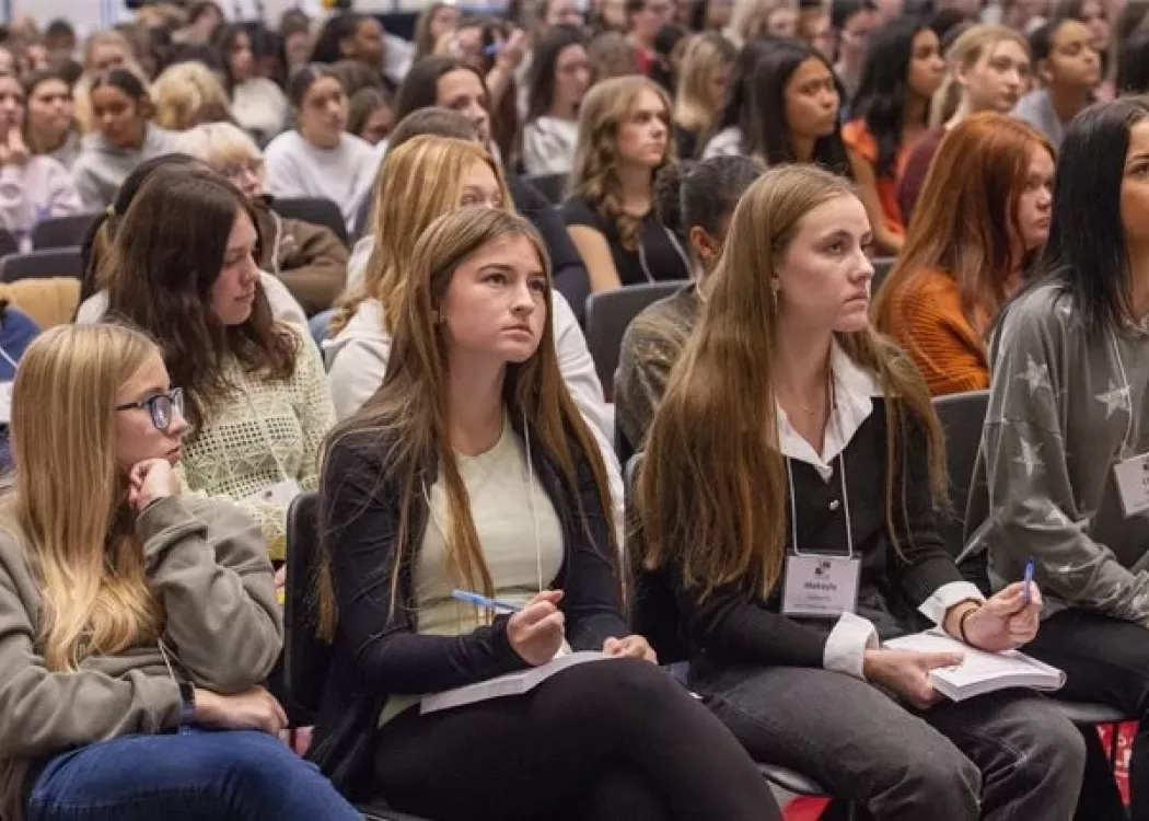 A large audience of women.