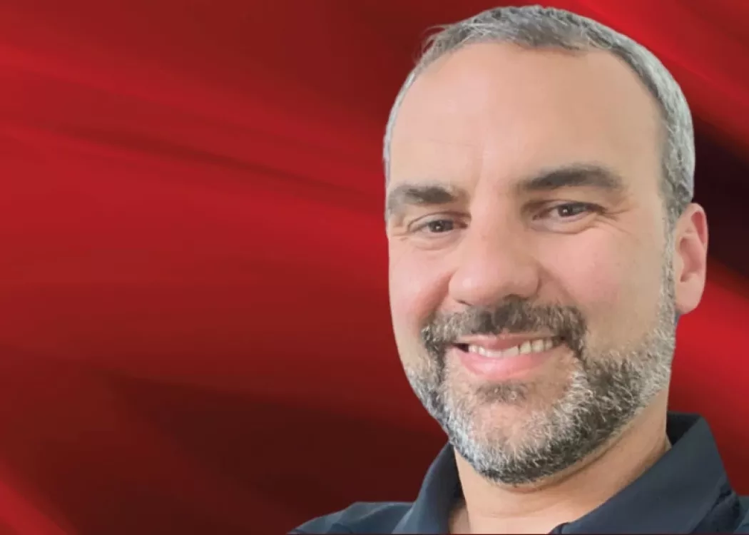 Ron Taylor headshot on red background