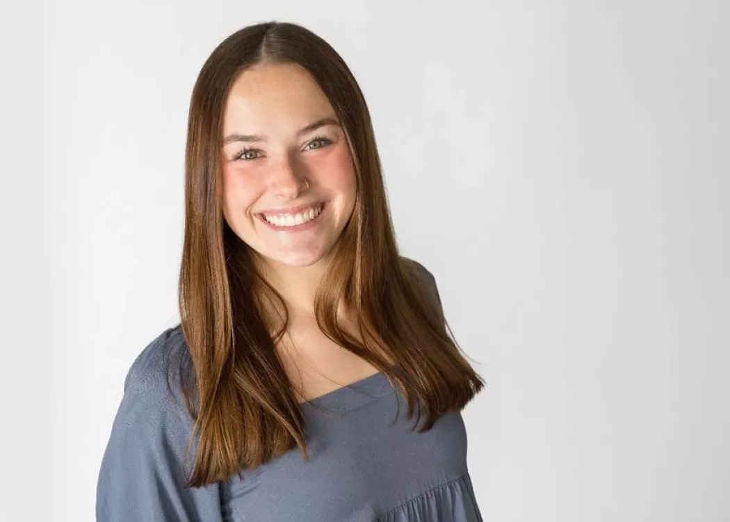 Outstanding Graduate, Kelsey Bruggeman, posing for photo