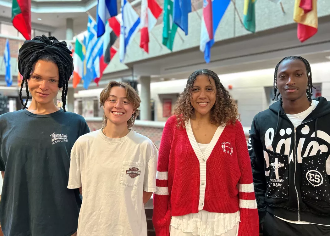 Four people standing