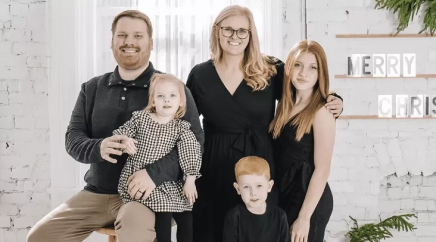 A teacher looking over a group of students in class.