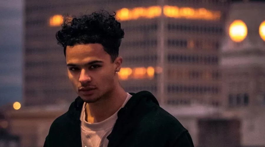 Headshot of a man outside at dusk.