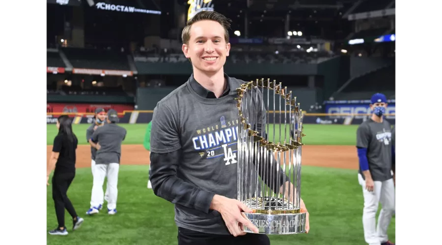 A man holding a trophy.