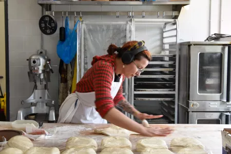 Employee Jackie Almanza rolls dough in the FOKO and La Pana kitchen
