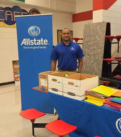 Thomas Allen participates in a Back to School event at a Louisville area school