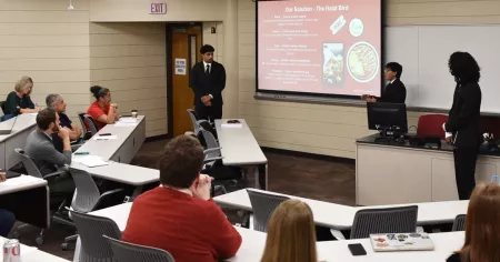 Student-Run Enterprise team members Mohammed Alyasseri, Zakariya Hassan and Petra Limbong pitch their concept, The Halal…